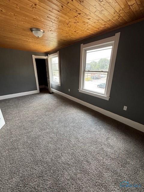 938 Western Ave, Toledo, OH 43609 - carpeted empty room with wooden ceiling and baseboards