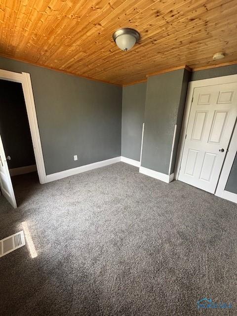 938 Western Ave, Toledo, OH 43609 - unfurnished room featuring wooden ceiling, carpet, baseboards, and crown molding