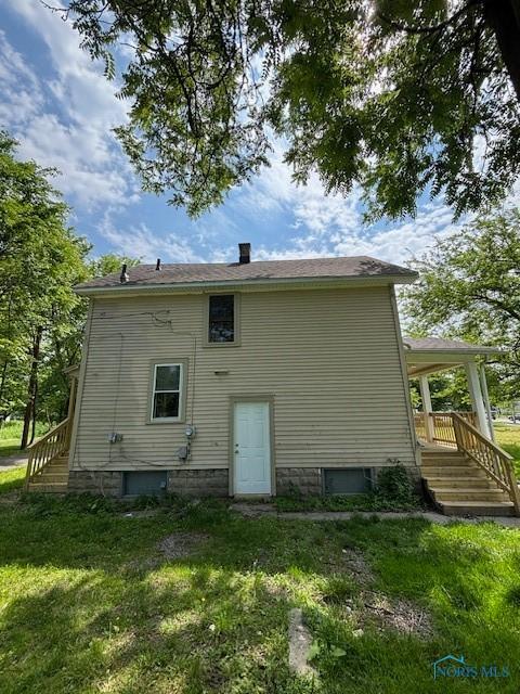 938 Western Ave, Toledo, OH 43609 - back of property featuring a yard and a chimney