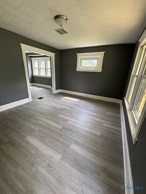 938 Western Ave, Toledo, OH 43609 - unfurnished room with wood finished floors and baseboards