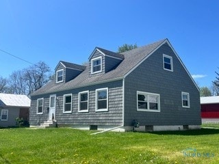 64 Saint Clair St, Tiffin, OH 44883 - rear view of property featuring a lawn and entry steps