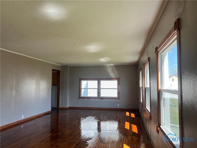 64 Saint Clair St, Tiffin, OH 44883 - unfurnished room featuring hardwood / wood-style flooring, baseboards, and ornamental molding
