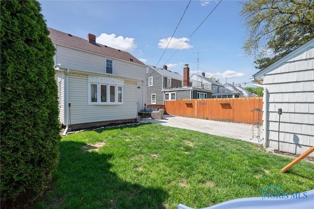 back of property with a patio area and a chimney