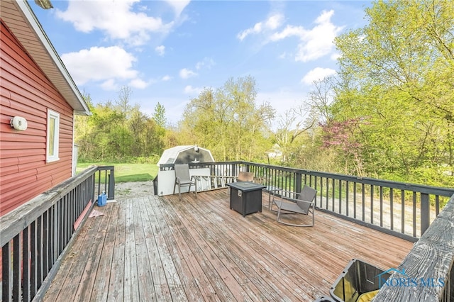 1037 Stevenson St, Napoleon, OH 43545 - wooden deck featuring view of scattered trees