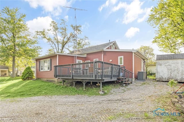 1037 Stevenson St, Napoleon, OH 43545 - rear view of property featuring central AC unit, a wooden deck, and a lawn