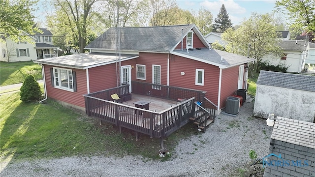 1037 Stevenson St, Napoleon, OH 43545 - rear view of house with a wooden deck, a lawn, central air condition unit, and a shingled roof