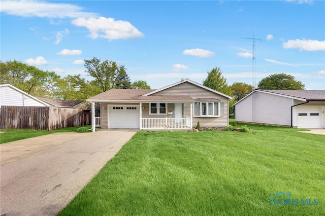 588 Douglas Dr, Wauseon, OH 43567 - ranch-style home with driveway, covered porch, and a garage