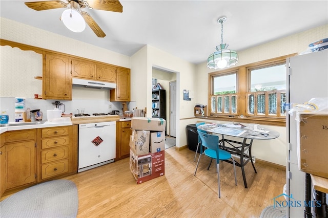 588 Douglas Dr, Wauseon, OH 43567 - kitchen featuring dishwasher, light wood-style flooring, under cabinet range hood, light countertops, and a ceiling fan