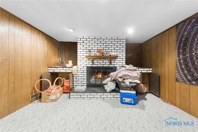 588 Douglas Dr, Wauseon, OH 43567 - interior space with carpet, wooden walls, and a brick fireplace
