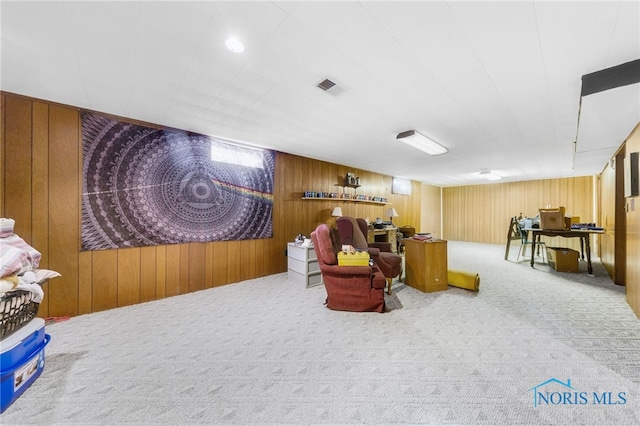 588 Douglas Dr, Wauseon, OH 43567 - sitting room with wood walls and carpet flooring