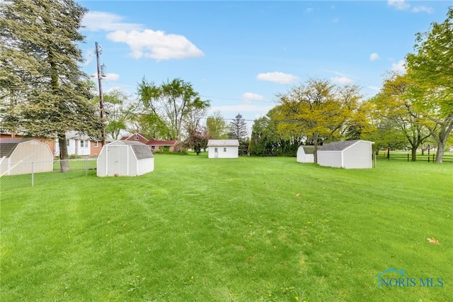 588 Douglas Dr, Wauseon, OH 43567 - view of yard featuring a storage shed and an outdoor structure