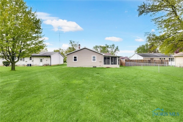 588 Douglas Dr, Wauseon, OH 43567 - back of house with a sunroom