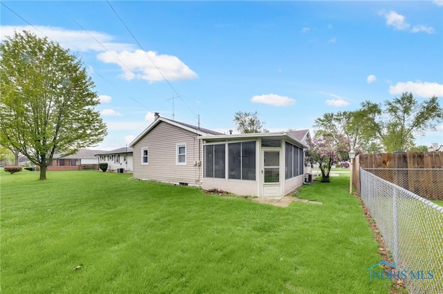 588 Douglas Dr, Wauseon, OH 43567 - rear view of house with a sunroom