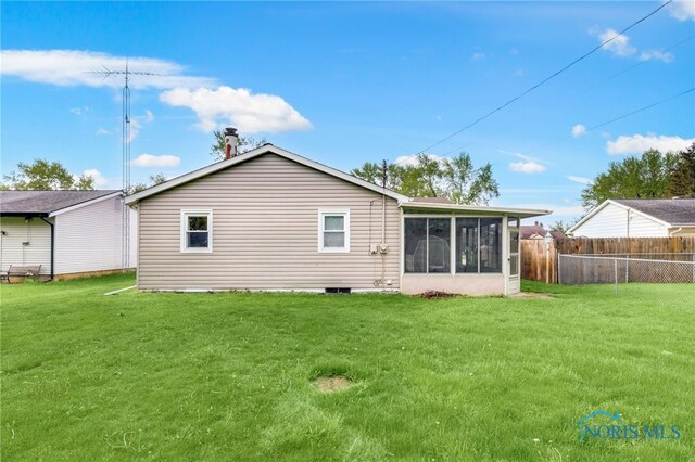 588 Douglas Dr, Wauseon, OH 43567 - rear view of property with a sunroom