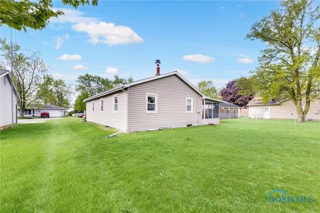 588 Douglas Dr, Wauseon, OH 43567 - rear view of house with a sunroom