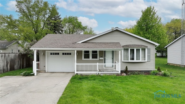 588 Douglas Dr, Wauseon, OH 43567 - ranch-style house featuring covered porch, an attached garage, roof with shingles, and concrete driveway