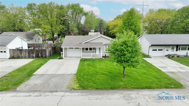 588 Douglas Dr, Wauseon, OH 43567 - single story home with concrete driveway and a porch