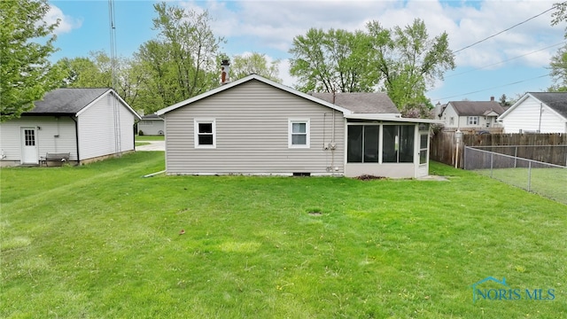 588 Douglas Dr, Wauseon, OH 43567 - back of house with a sunroom