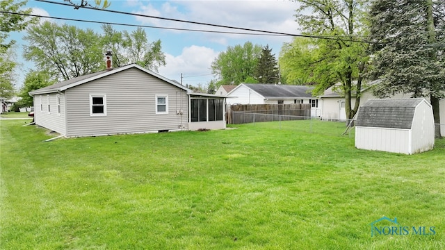 588 Douglas Dr, Wauseon, OH 43567 - rear view of property with a sunroom, a storage shed, and an outdoor structure