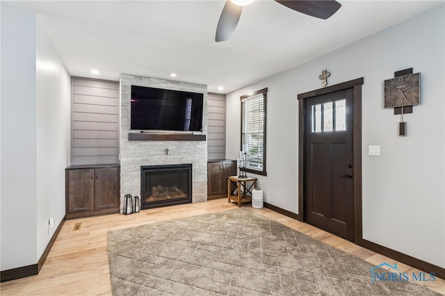 308 E Main St, Vanlue, OH 45890 - foyer entrance featuring ceiling fan, wood finished floors, baseboards, a large fireplace, and recessed lighting