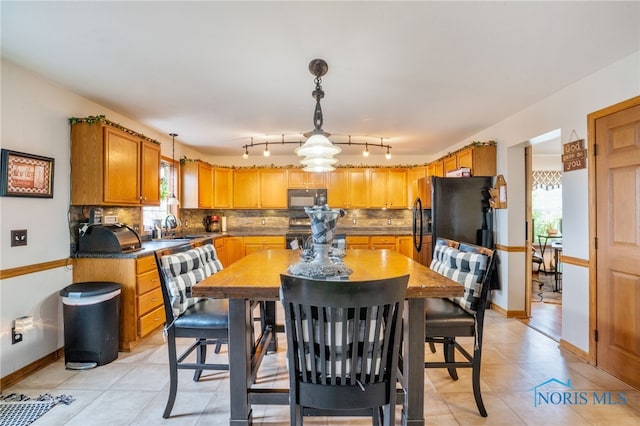 9704 Monto Ln, Findlay, OH 45840 - dining room with baseboards and light tile patterned flooring
