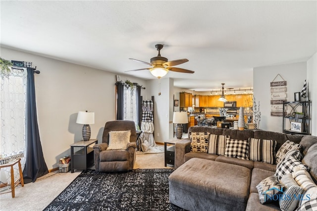 9704 Monto Ln, Findlay, OH 45840 - living room with ceiling fan, light carpet, and baseboards