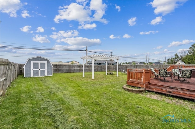 9704 Monto Ln, Findlay, OH 45840 - view of yard featuring a wooden deck, a storage shed, a pergola, and an outdoor structure