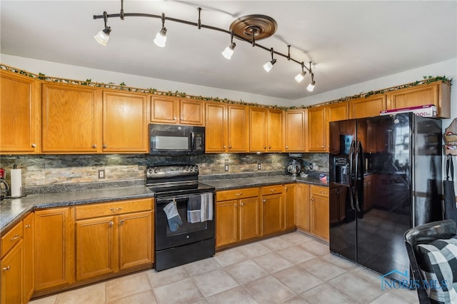 9704 Monto Ln, Findlay, OH 45840 - kitchen featuring black appliances, brown cabinetry, and backsplash