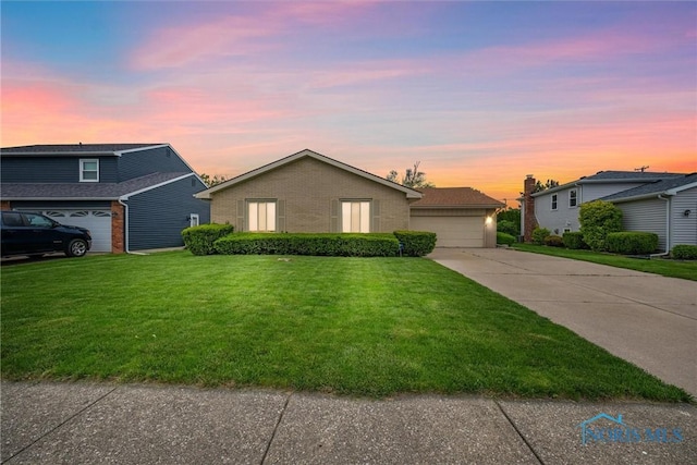 2659 Coveview Dr, Toledo, OH 43611 - view of front facade with brick siding and a yard