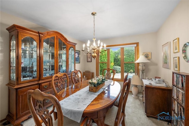 2659 Coveview Dr, Toledo, OH 43611 - dining area featuring a chandelier and light carpet
