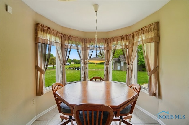 29030 Hufford Rd, Perrysburg, OH 43551 - dining space with baseboards and light tile patterned floors