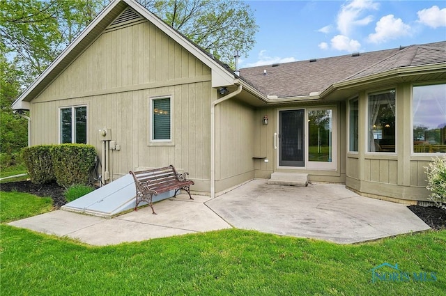 29030 Hufford Rd, Perrysburg, OH 43551 - rear view of property with roof with shingles, a patio, and a lawn