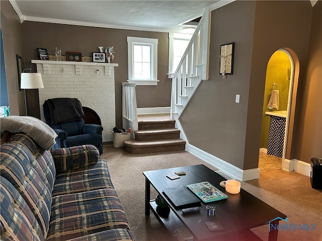 854 Maple Ave, Findlay, OH 45840 - carpeted living room featuring crown molding, stairway, baseboards, and a brick fireplace