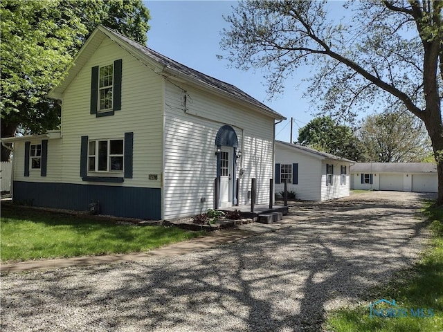 S832 County Road 20b, Archbold, OH 43555 - view of side of home with a garage