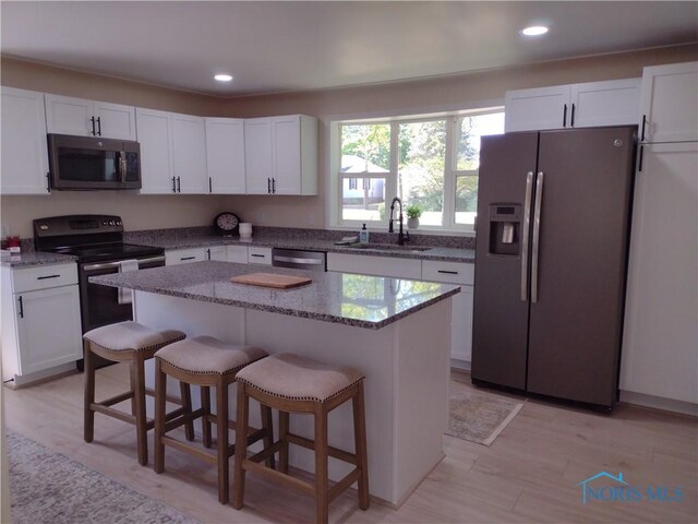 S832 County Road 20b, Archbold, OH 43555 - kitchen featuring appliances with stainless steel finishes, a sink, white cabinetry, and recessed lighting