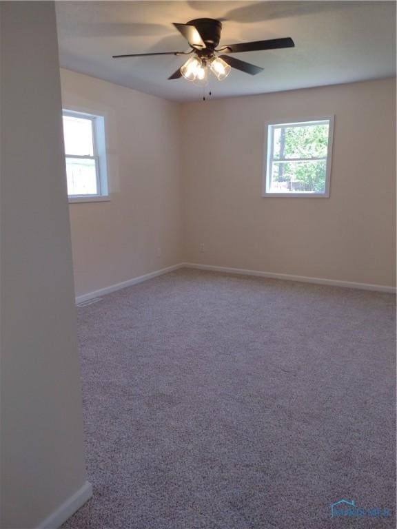 S832 County Road 20b, Archbold, OH 43555 - spare room featuring healthy amount of natural light, baseboards, and carpet