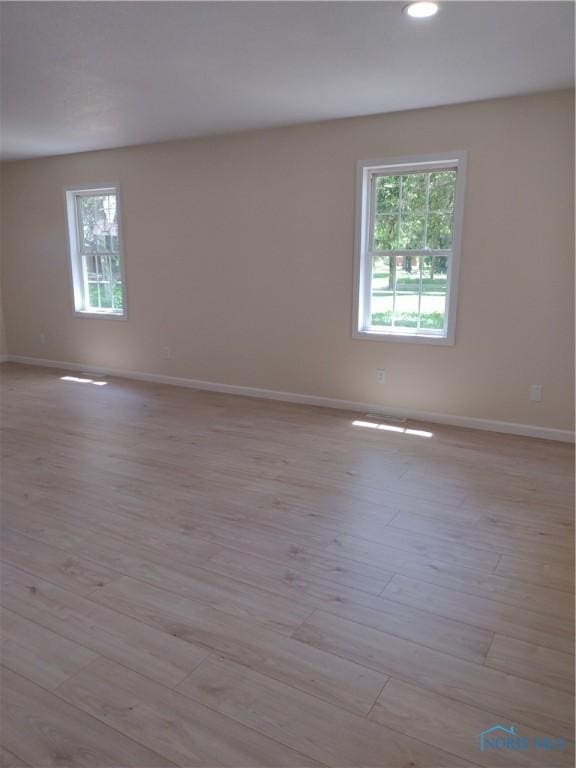 S832 County Road 20b, Archbold, OH 43555 - empty room featuring baseboards, light wood-style flooring, and recessed lighting