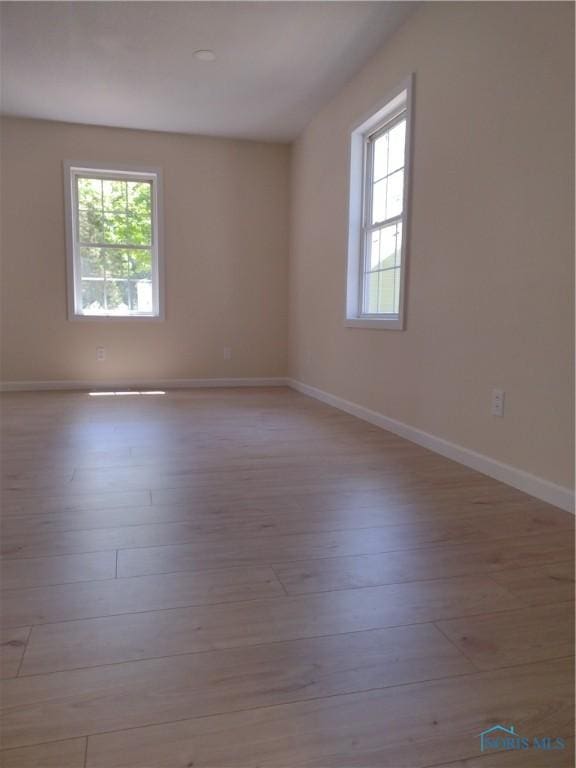 S832 County Road 20b, Archbold, OH 43555 - spare room with hardwood / wood-style flooring and baseboards