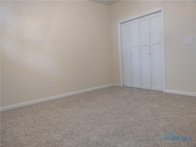 S832 County Road 20b, Archbold, OH 43555 - unfurnished bedroom with carpet floors, baseboards, and a closet