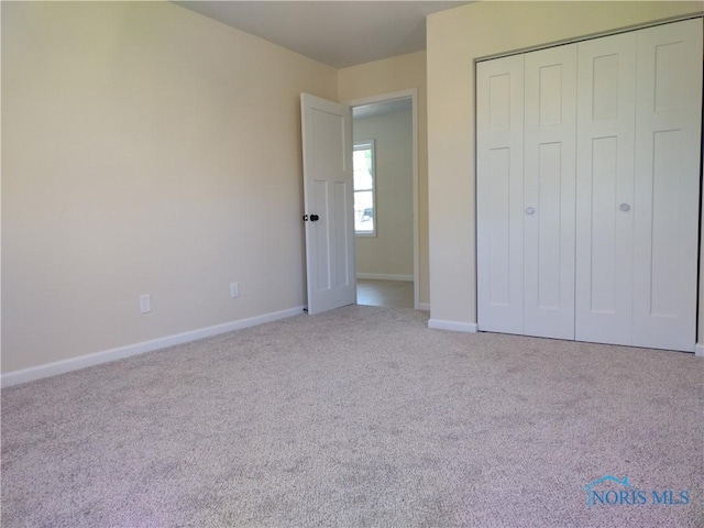 S832 County Road 20b, Archbold, OH 43555 - unfurnished bedroom with carpet flooring, baseboards, and a closet