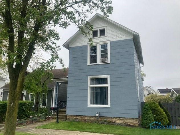 94 Liberty St, Tiffin, OH 44883 - american foursquare style home featuring fence