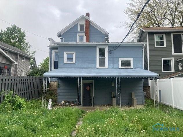 94 Liberty St, Tiffin, OH 44883 - rear view of house with fence