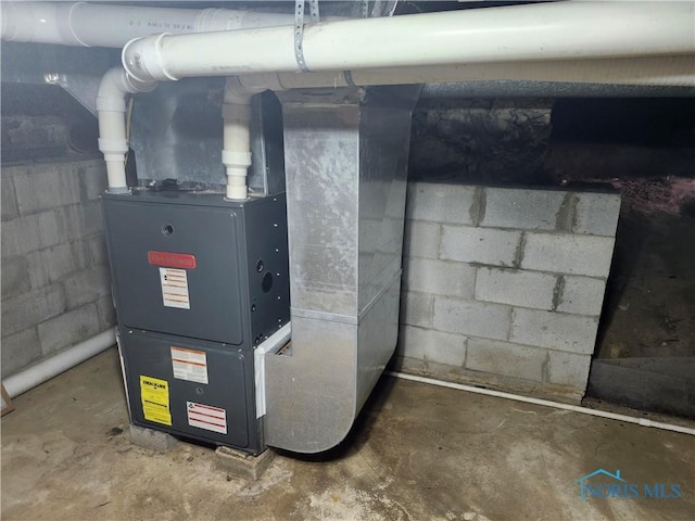 900 Leonard St, Fostoria, OH 44830 - utility room featuring heating unit