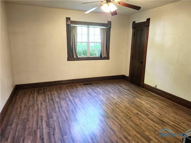 900 Leonard St, Fostoria, OH 44830 - empty room with ceiling fan, wood finished floors, and baseboards