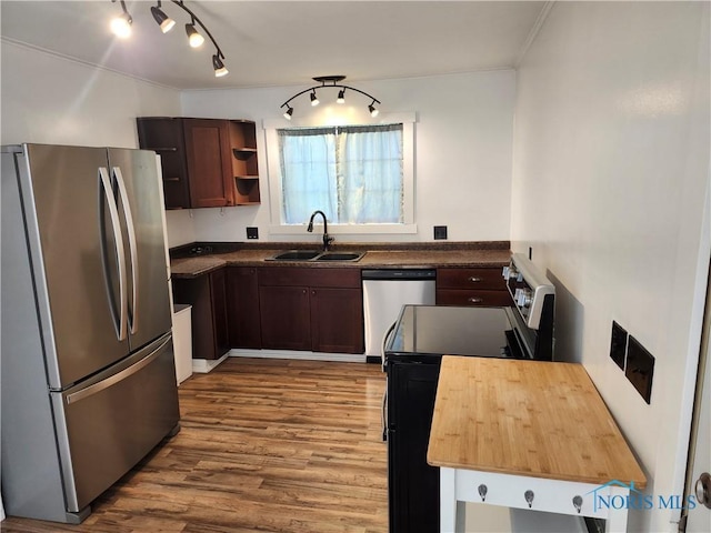 900 Leonard St, Fostoria, OH 44830 - kitchen featuring appliances with stainless steel finishes, a sink, wood finished floors, open shelves, and ornamental molding