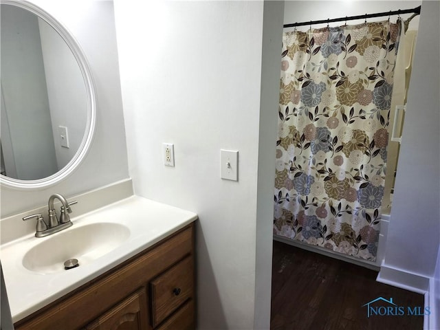 900 Leonard St, Fostoria, OH 44830 - full bath featuring wood finished floors, vanity, and curtained shower