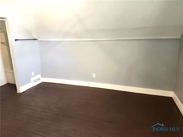 900 Leonard St, Fostoria, OH 44830 - additional living space with dark wood-type flooring and baseboards