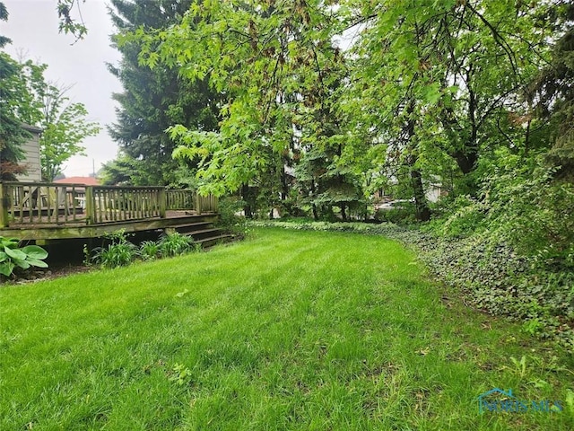 4405 Oldenburg Dr, Toledo, OH 43611 - view of green lawn with a wooden deck