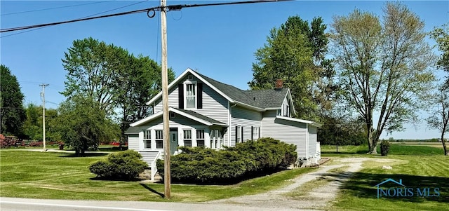 211 S Keyser St, Holgate, OH 43527 - view of front facade featuring driveway and a front lawn