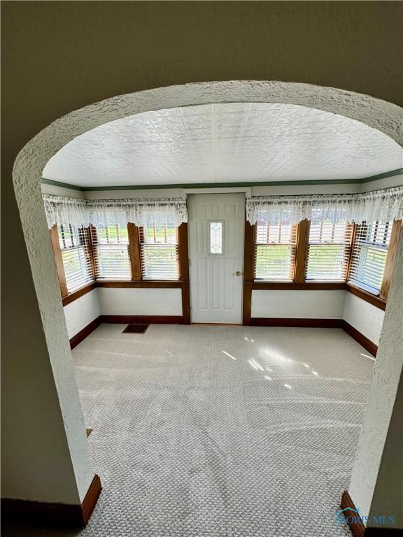 211 S Keyser St, Holgate, OH 43527 - entrance foyer featuring baseboards, light carpet, and a textured ceiling